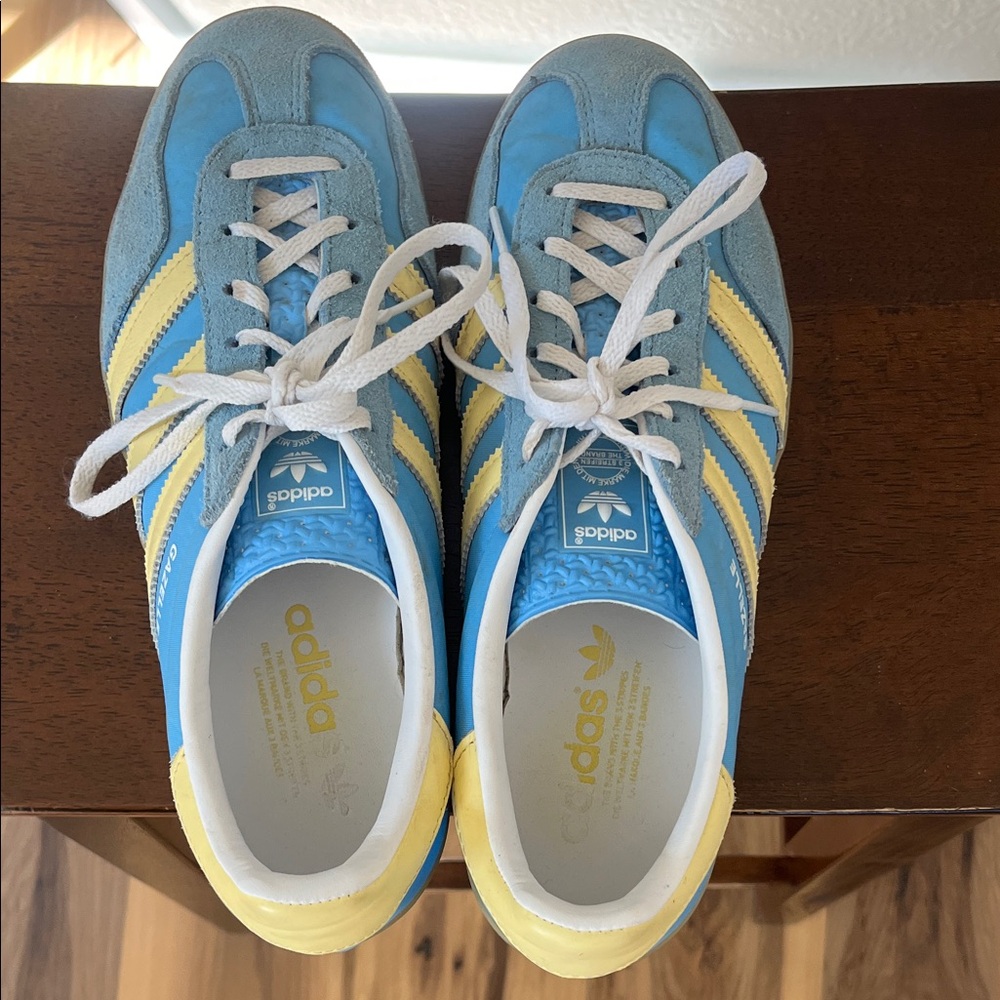 adidas  Gazelles- Light Blue Sneakers with Yellow Stripes